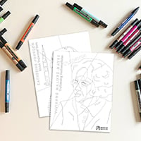 Aerial view of blank colouring pages sitting on a table surrounded by markers